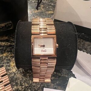Dolce and Gabbana rose gold watch, works perfectly!